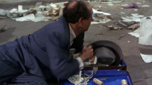 The War of the Worlds (1953) scene: Ned Glass as a negative Jewish stereotype weakly on the ground, surrounded by garbage, clutching his money.